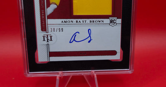 2021 Panini National Treasure Collegiate Amon-Ra St. Brown RPA 38/99 #84